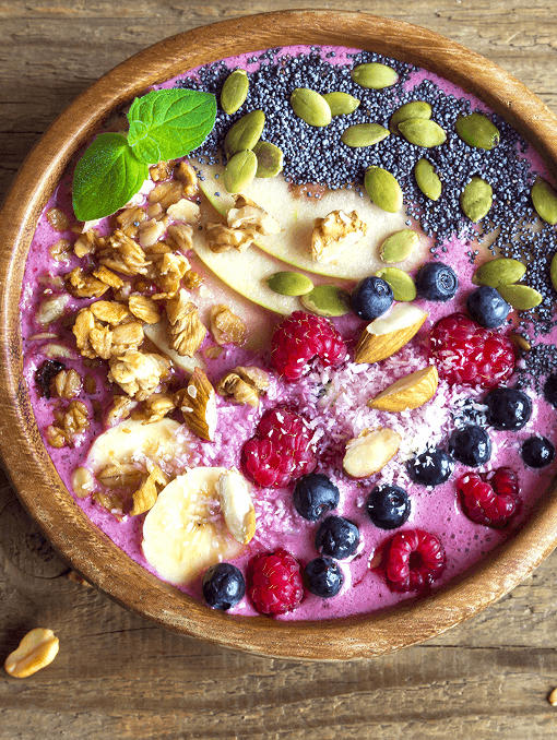 An acai bowl with fruit and nuts