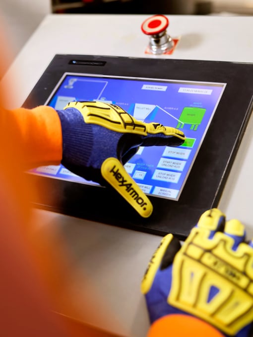 Closeup of a person’s gloved hands operating a touchscreen