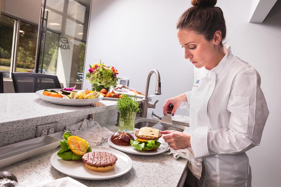 ADM Chef preparing a burger using pea proteins