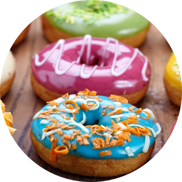 Donuts with a variety of brightly colored icings