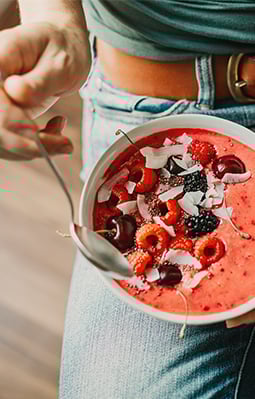 Women enjoying a plant-based smoothies bowl