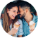 A man and woman share a close laugh while enjoying reduced sugar ice cream cones.
