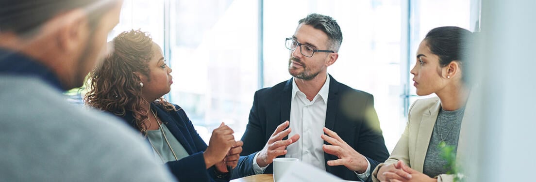 A group of investors collaborating in a meeting