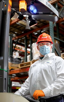 man in hard hat and white coat